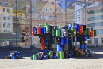 In the historic centre of Nuremberg, art with barrels in front of the Neues Museum Nuremberg, State