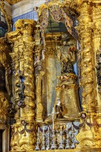 Baroque gold-leafed altar in the historic church of Pelourinho in the city of Salvador, Bahia,