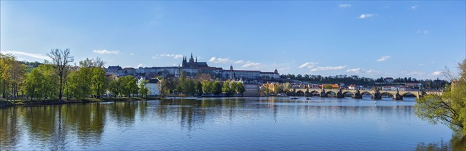 Panorama view of Charles bridge over Vltava river and Gradchany (Prague Castle) and St. Vitus