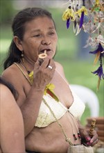 Indigenous woman with a pipe, Salvador, State of Bahia, Brazil, South America