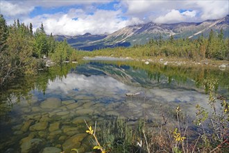 Crystal clear lake reflecting trees and mountains, autumn atmosphere, calendar picture, Copper