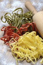 Tagliatelle tricolore, Italian pasta with dough roll