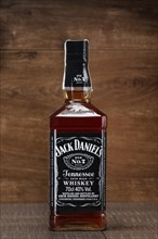 Minsk, Belarus, December 13, 2016: Bottle of Jack Daniels on wooden counter as part of retail expo,