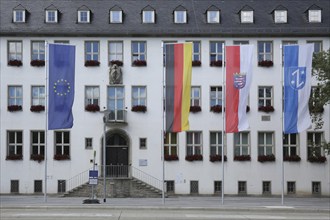 EU flag, state flag, national flag and city flag in front of the town hall, Rüsselsheim, four,