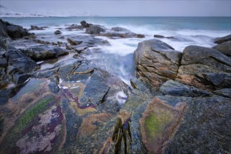 Waves and rocks on coast of Norwegian sea in fjord. Skagsanden beach, Flakstad, Lofoten islands,