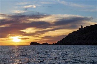 Lighthouse, Faro di Punta Libeccio, sunset, dusk, blue evening sky, grey clouds, Marettimo, Egadi