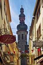 Tower of the parish church of St. Martin in a narrow alley in the historic old town, Cochem,