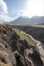 Valley with river Achik Tash between high mountains, mountain landscape with peak Pik Lenin, Osh