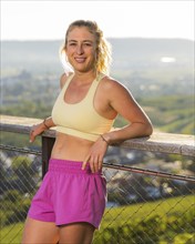 Young woman in Fitness training, vineyard at Grossheppach, Remstal valley, Baden Württemberg,