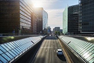 Street traffic in Brussels near European Commission building on sunset. Rue de la Loi, Bruxelles,