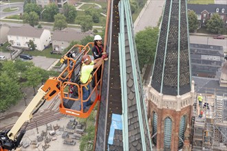 Detroit, Michigan, Workers repair the towers of the Basilica of Ste. Anne de Detroit. Ste. Anne was