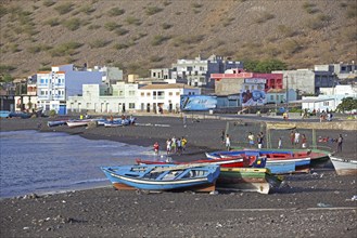 Colourful wooden fishing boats on the black sand beach of Tarrafal de São Nicolau on the island São