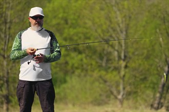 Fisherman with rod ready to make a cast