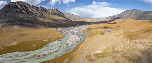 Aerial view, Burkhan mountain valley with meandering river, barren dramatic mountain landscape,