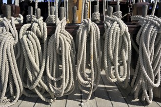 Ropes coiled around belaying pins aboard the Grand Turk, Etoile du Roy, a three-masted sixth-rate