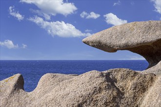 Strange rock formations and water, wind eroded boulders along the Côte de granit rose, Pink Granite