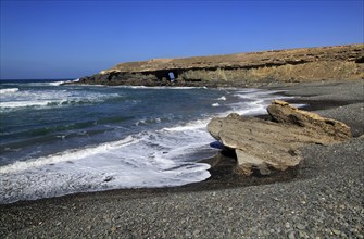 Waves breaking on beach at Playa de Garcey, Fuerteventura, Canary Islands, Spain, Europe