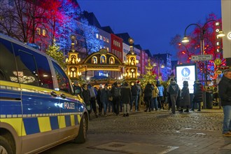 Police patrol car in front of the Christmas market on the Alter Markt in the old town of Cologne,