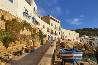 Morning light, row of houses, colourful houses, boat, Levanzo town, main town, Levanzo, Egadi