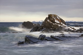 Rocks in the surf along the coast of Gimsoy, Gimsøy, Austvagoya, Austvågøy, Lofoten archipelago,