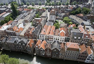 Raised oblique aerial view over historic rooftops in the city centre, Dordrecht, Netherlands