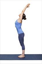 Woman doing Hatha Yoga asana Tadasana, Mountain pose with stretched hands isolated