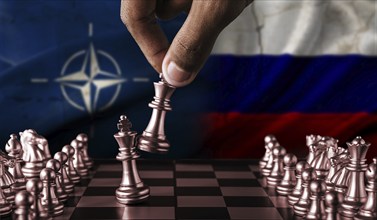 Political tension between Russia and NATO. Russia vs NATO flag on chessboard