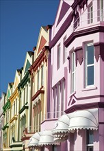 Colourfully painted guesthouses and hotels on the Esplanade, Paignton, Devon, England, United