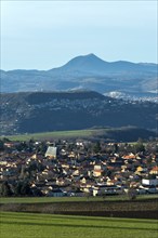 View on Vic le Comte village, Puy de Dome volcano in background, Limagne plain, Puy de Dome