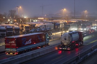 Heavy traffic on the A2 at the Bottrop-Süd service area, overcrowded lorry parking in the evening,