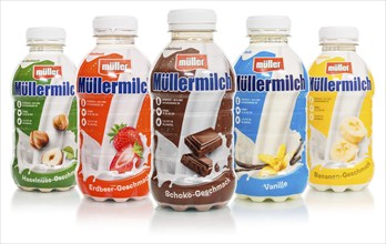 Muller's milk of various flavours in bottles from Theo Müller, cropped against a white background