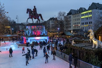 Ice rink at the Christmas market on the Heumarkt in the old town of Cologne, Sunday shopping in