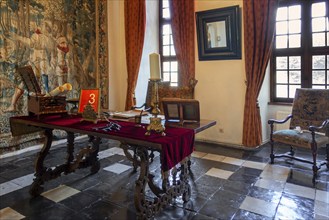 Kasteel van Laarne, interior showing room with antique furniture and tapestry inside 14th century