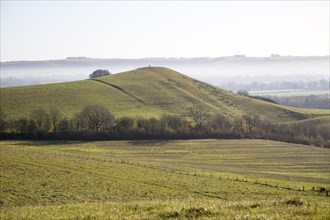 Picked Hill chalk outlier landscape misty valley floor, Vale of Pewsey, from Woodborough Hill,