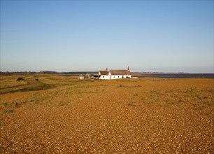 Seaside bungalow on shingle beach near North Weir Point, Shingle Street, Suffolk, England, UK