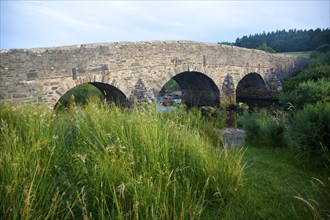 Historic Packhorse bridge at Postbridge, Dartmoor national park, Devon, England, UK crossing the