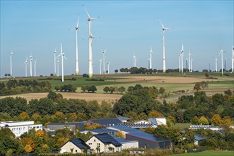 Wind farm above the village of Lichtenau, self-proclaimed energy town, houses with photovoltaic