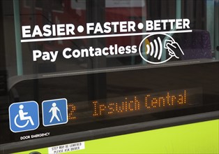 Pay Contactless sign on bus window, Ipswich, Suffolk, England, Uk