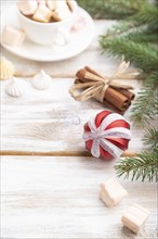 Christmas or New Year composition. Decorations, box, balls, cinnamon, fir and spruce branches, cup