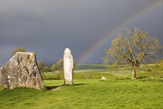 Rainbow over standing stones at Avebury, Wiltshire, England, UK