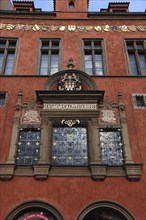 House facade with coat of arms on the historic Old Town Hall on the Old Town Square, Prague, Czech