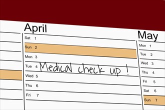 Symbolic image: Appointment diary with note for preventive medical check-up (English)