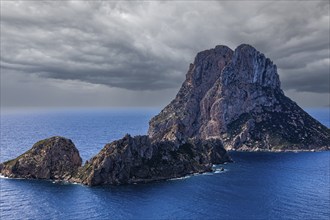 Dark clouds over the rocks in the sea Es Vedra and Es Vedranell at Cap Blanc, Ibiza, Balearic