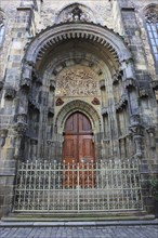 The north portal with tympanum of the Teyn Church, a Roman Catholic church of the Virgin Mary in