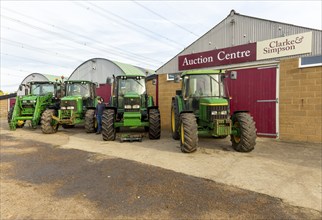 Row of John Deere tractors in farm machinery auction sale, Campsea Ashe, Suffolk, England, UK