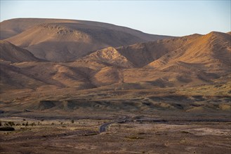 Mountain and hilly landscape in the evening light, sandstone hills, Fint, Morocco, Africa