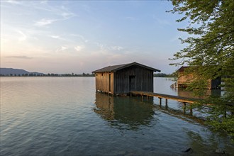 Boat huts with wooden jetty, sunset at Lake Kochel near Kochel am See, Bavarian Alpine foothills,