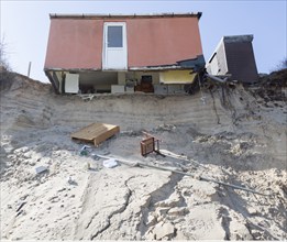 March 2018, Clifftop property collapsing due to coastal erosion after recent storm force winds,