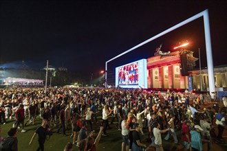 Football fans leaving the fan zone at the Brandenburg Tor after the final match between Spain and