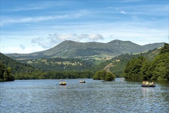 Summer activities on Lake Chambon with the Sancy Massif in the background, Puy-de-Dôme,